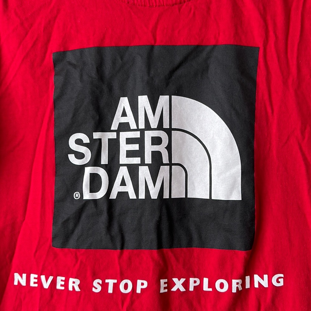 Amsterdam “Never Stop Exploring” red tee